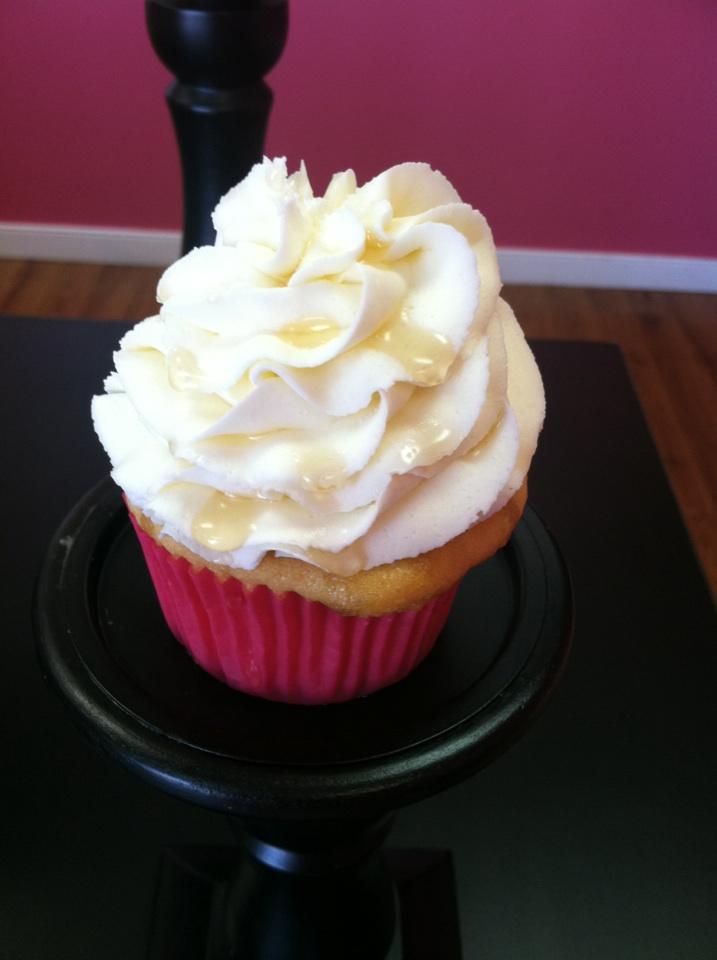 Honey flavored yellow cupcake topped with a lightly flavored honey buttercream and a drizzle of honey.